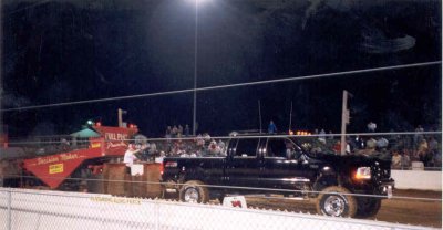 my 2003 truck pulling the sled at the buck 1.jpg